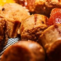 Smoked Bratwurst Bites · Delicious and juicy bratwurst with red ale cheese dip and shack toast.
