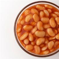 Baked Beans · Slow baked beans with onion, bacon and brisket rich with molasses and brown sugar.