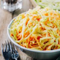 Cole Slaw · Tangy slaw with a touch of horseradish in a mayo based dressing.
