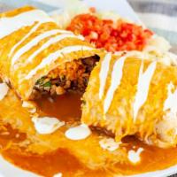 Meat Burrito · Flour tortilla with  refried beans, choice of meat, mexican rice, and onion and cilantro. Pl...