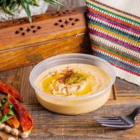 Spicy Hummus · Crushed jalapenos and spices are added to our classic hummus for some flavorful heat.