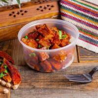 Hot Potato Hash · Crispy hand-cut potatoes tossed in a slightly spiced tomato, garlic, and chili sauce and top...