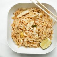 Pad Thai · Thin rice noodle stir-fried with eggs, green onion, bean sprout, ground peanut and a wedge o...