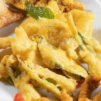 Saffron Sampler · Assorted of Chicken Pakoras, Amritsari fish, vegetable samosa and vegetable pakoras served w...