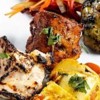 Saffron Mixed Grill · (GF) Assortment of chicken tikka, hariyali chicken, malai chicken and paneer kebabs