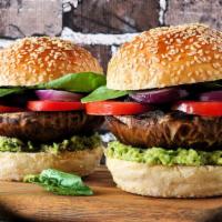 Vegan Mushroom & Cheese Burger · Plant-based patty topped with mushrooms, sliced vegan cheese, lettuce, tomato, onion, and pi...
