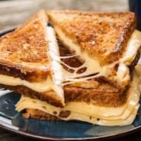 Classic Grilled Cheese · Melted American cheese between two slices of buttery grilled bread