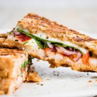 Veggie Grilled Cheese · Melted cheddar cheese, ripe avocado, tomato, grilled onions, roasted red & green peppers, an...