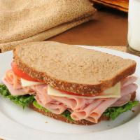 The Ham And Cheese · Melted American cheese and ham between two slices of buttery grilled bread