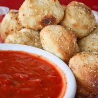 Garlic Knots · Our house-made garlic knots are seasoned with garlic and butter, then baked to perfection. s...