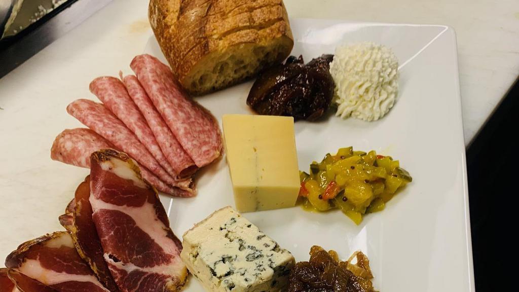 Fromage And Charcuterie Plate · Cheeses & cured meats,  seasonal chutney and relish, balsamic onions, fresh fruit,  nuts, baguette, rosemary crackers