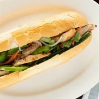 Bánh Mì Thịt Gà · Sandwich serve with grilled chicken.