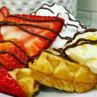 Waffles On Waffles · Delicious buttermilk waffles topped
with creamy butter and whipped cream. Served with an egg...