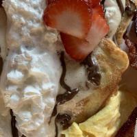 I ♥ French Toast · Fluffy, thick cut French toast topped with seasonal fruit or berries, whipped cream and butt...