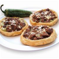 Steak Or Chicken Sopes (3) · Three deep-fried thick corn tortillas filled with beans, red or green sauce, topped with que...