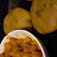 Aloo Tikki · Potato patties seasoned with herbs and spices.