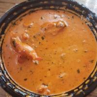 Butter Chicken · Red meat of tandoori chicken in fenugreek leaves and cooked with creamy tomato sauce.