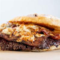 The B&B · Grass-fed beef, blackened with Cajun spice, applewood bacon and bleu cheese on our garlic fo...