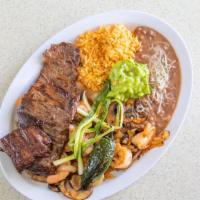 Carne Asada Con Camarones · Broiled steak and six al ajillo shrimp with rice, beans, salad, and tortillas.