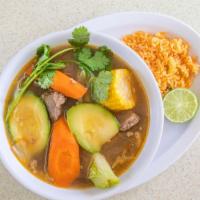 Caldo De Res · Beef soup with veggies and rice.