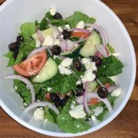House · Fresh chopped lettuce, cucumbers, tomatoes, red onions, black olives, feta cheese.