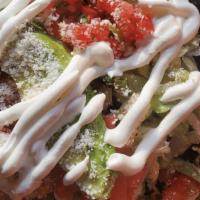 Tostadas · Gluten free. A crispy corn tortilla topped with beans black, refried or whole pinto, crisp l...