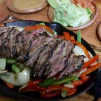 Steak Fajitas Combo (New) · Steak fajitas served sizzling hot on a bed of sauteed onions, peppers, mushrooms, and season...