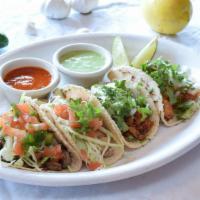 Mexican Street Tacos (1 Pc) · Meat options: Pollo Asado, Machaca, Shredded Chicken, Chorizo, Pastor or Carnitas.