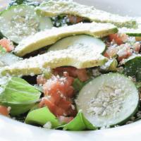 Tostada Salad · Gluten free. Crisp romaine lettuce and fresh spinach are combined with avocado, cucumbers, f...