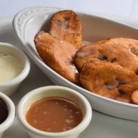 Platano Frito · Fried plantain covered in your choice of mexican lechera, chocolate or caramel.