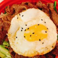 Bibimbap · Rice with assorted vegetable, bulgogi beef and fried egg on top. Gochujang sauce serve with ...