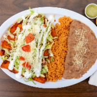 Enchiladas  · Four (4) corn tortillas with choice of meat. Covered in a delicious enchilada sauce. Served ...