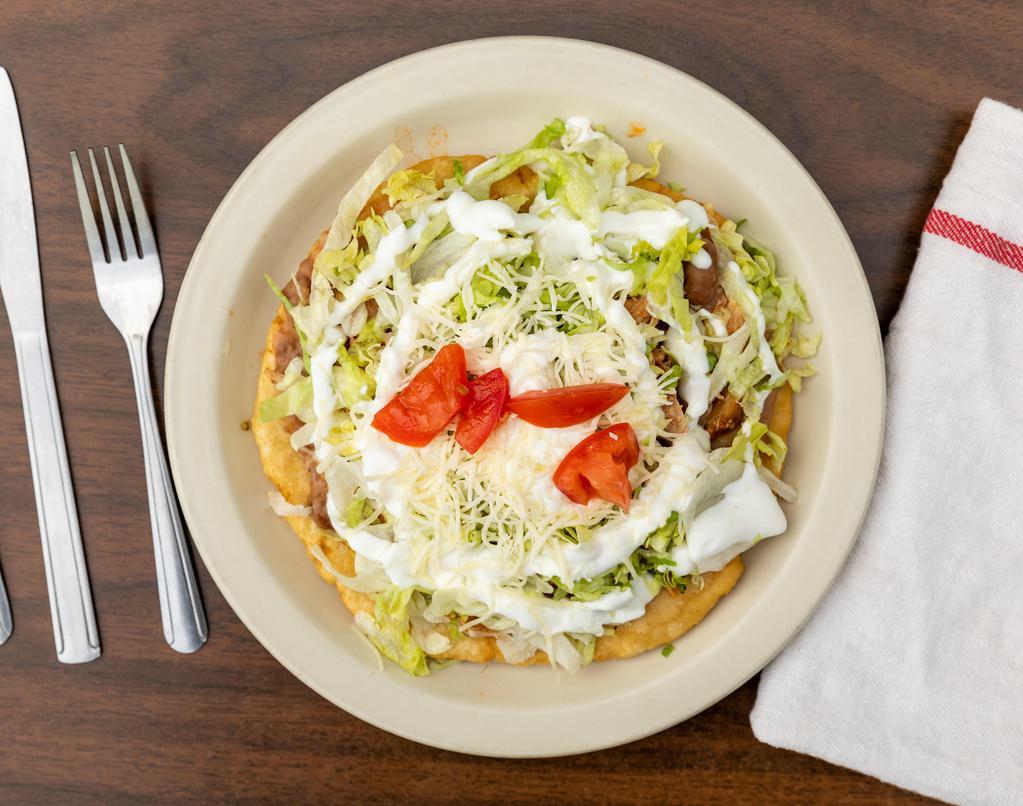 Big Sope · Deep fried masa shell topped with choice of meat, lettuce, tomato, sour cream and cheese.