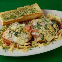 Jumbo Chick Parm · Huge all natural chicken breast served on a bed of fettuccine and topped with our homemade m...