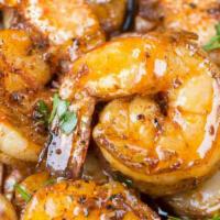 Six Pack Shrimp · Six BIG tail-on shrimp sautéed in a spicy chipotle garlic butter and served with our border ...