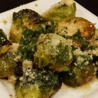 Cavolini · Roasted Brussels sprouts tossed with lemon and garlic, topped with grated parmesan cheese