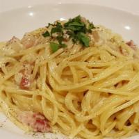 Spaghetti Carbonara · Prepared traditionally with pancetta, minced shallots, egg yolk and a pinch of black pepper,...