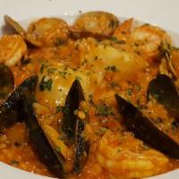 Risotto Di Mare · Manila clams, PEI mussels, jumbo shrimp and sea scallops simmered in a garlic and fresh herb...