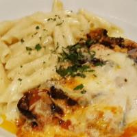 Melanzane Parmigiana · Organic eggplant topped with mozzarella cheese in a tomato basil sauce baked in the oven and...