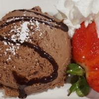 Chocolate Mousse · Made in house from fresh cream and plenty of Belgian dark chocolate, with a sliced strawberr...
