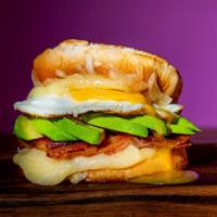 Signature Grilled Cheese · Provolone Cheese, Bacon, Avocado and a Fried Egg.