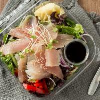 Albacore Salad · Albacore sashimi, on a bed of baby greens, daikon, cucumbers, and ponzu sauce.