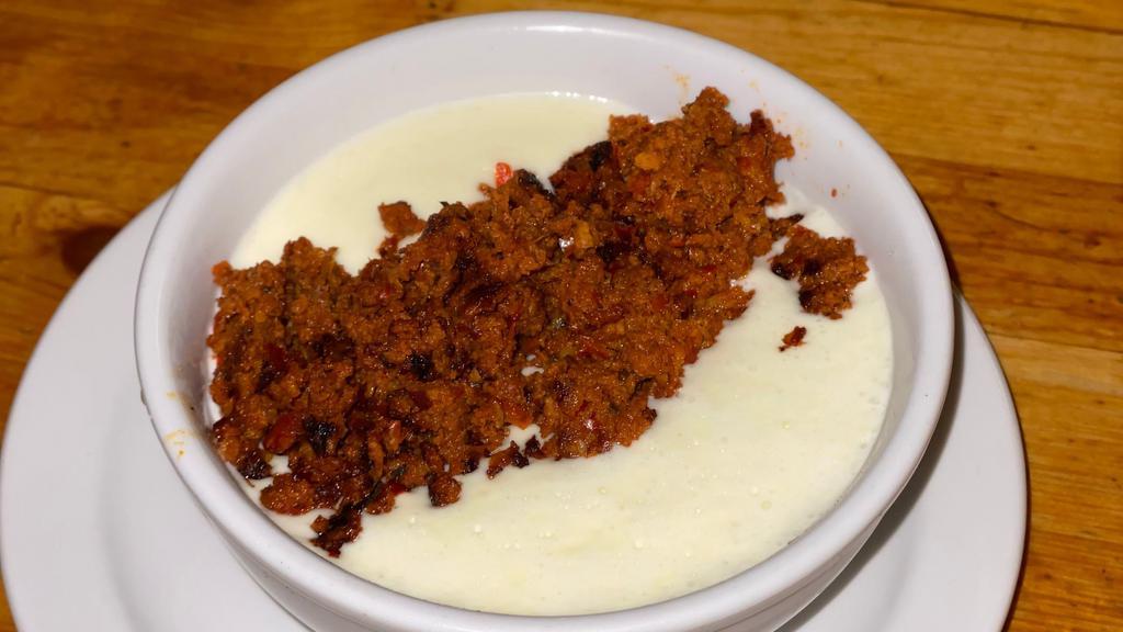 Choriqueso · Great combination of dip cheese and our homemade chorizo (mexican sausage).