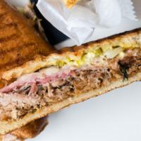 Cubano Sandwich · Slow-roasted pork shouLder, hoagie roll, swiss cheese, prosciutto, pickled jalapeños & onion...