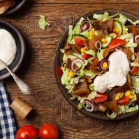 Gyro Salad · Fresh salad made with roasted gyro meat, lettuce, tomatoes, cucumbers, onions, olives, and f...