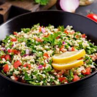 Tabbouleh Salad · Fresh salad made with parsley, mint, crushed wheat, tomatoes, onions, lemon juice, and olive...