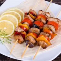 Shish Kabob · Tender fillet of lamb or beef kabobs marinated in a special sauce, skewered with onions and ...