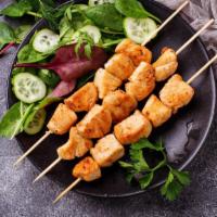 Shish Taouk · Chicken cubes marinated in a mix of garlic, saffron and other middle eastern spices. Served ...