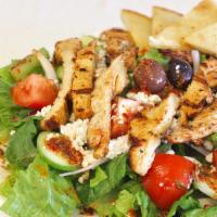 Chicken Salad · greek salad with grilled  chicken breast on the top and  Served with pita and dressing