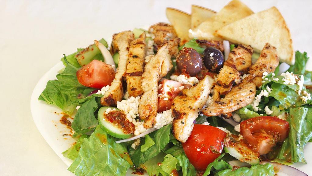 Chicken Salad · greek salad with grilled  chicken breast on the top and  Served with pita and dressing